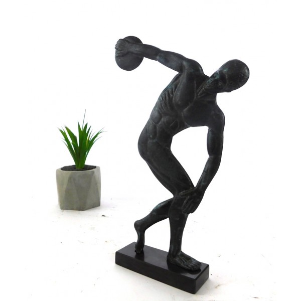 A discus thrower is depicted about to release his throw