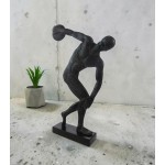 A discus thrower is depicted about to release his throw, bronze sculpture A discus thrower is depicted about to release his throw, bronze sculpture