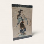 The 'Adorants Fresco' , woman holding a necklace